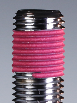 Precote 80 high strength pre-applied thread locker — pink microencapsulated acrylate coating on fastener, 340°F rated
